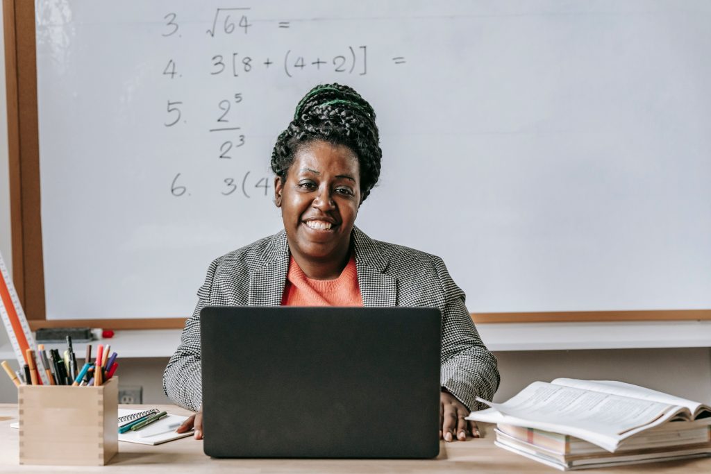 Teacher using CMIS on her laptop in the classroom