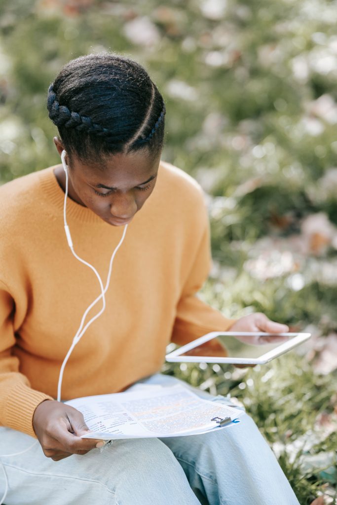 Black student using a tablet to access CMIS